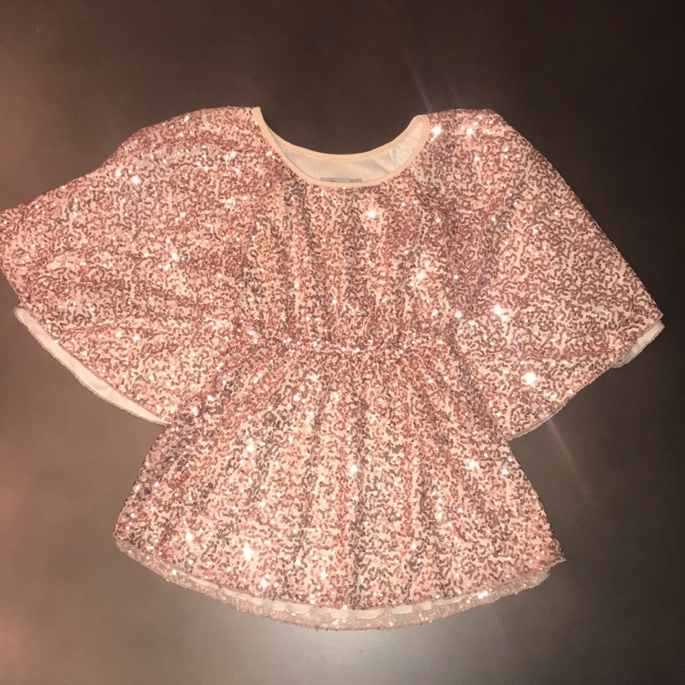 Sequin top, flared below waist